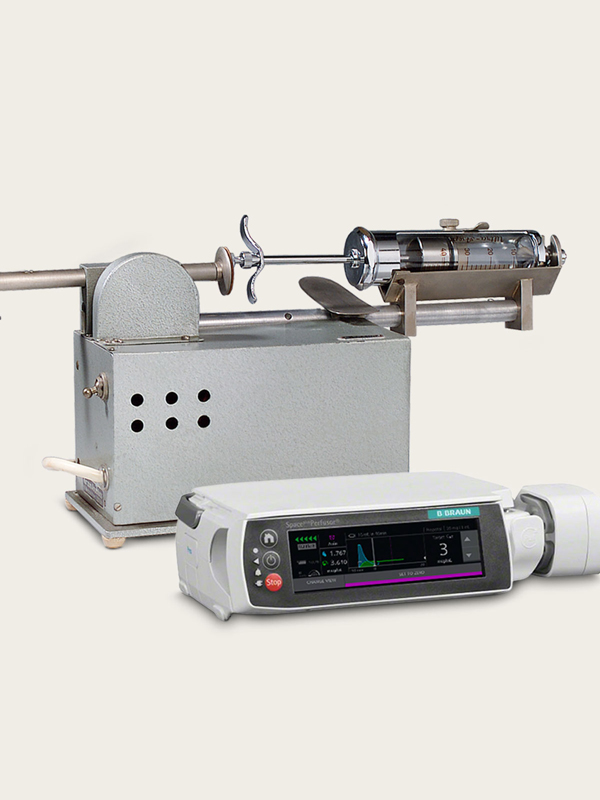 Historic and modern infusion pumps side by side.