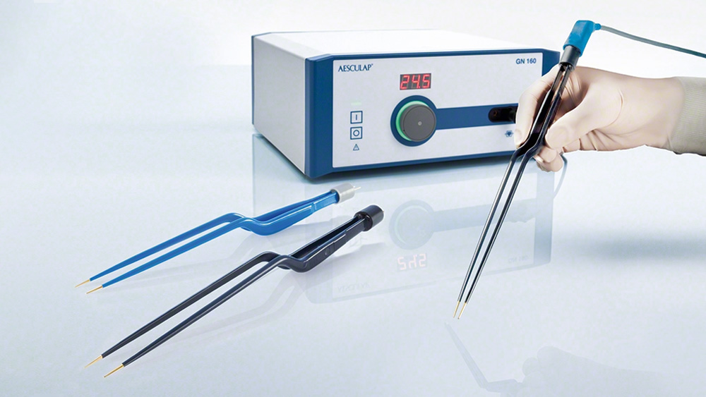 Hands of a medical worker holding a bipolar coagulation